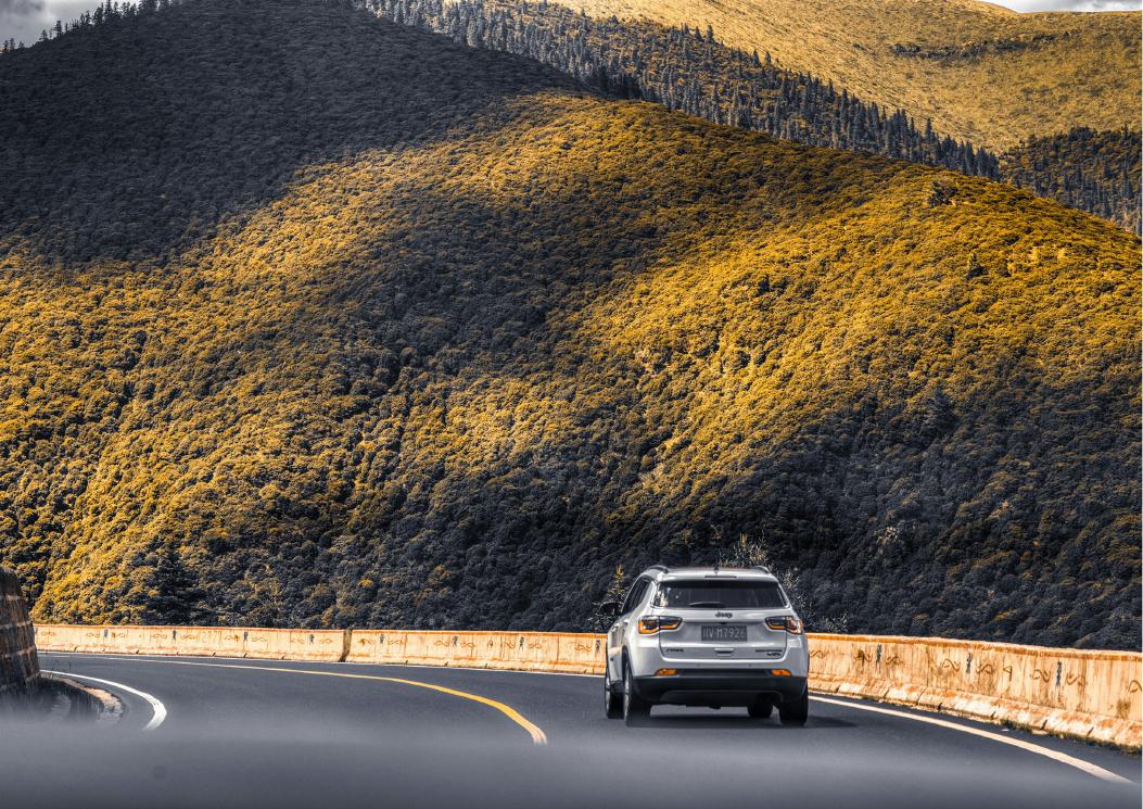 A road winding through high mountains, temporary journey placeholder
